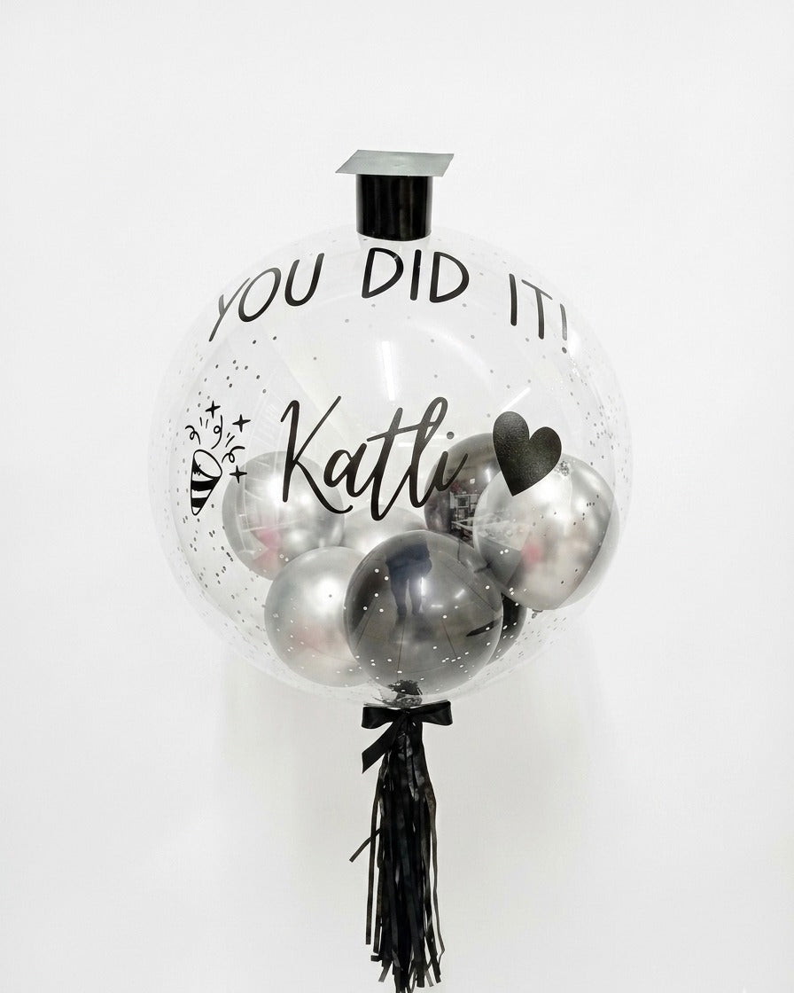 Decorative balloon with 'You Did It! ' text on a white background