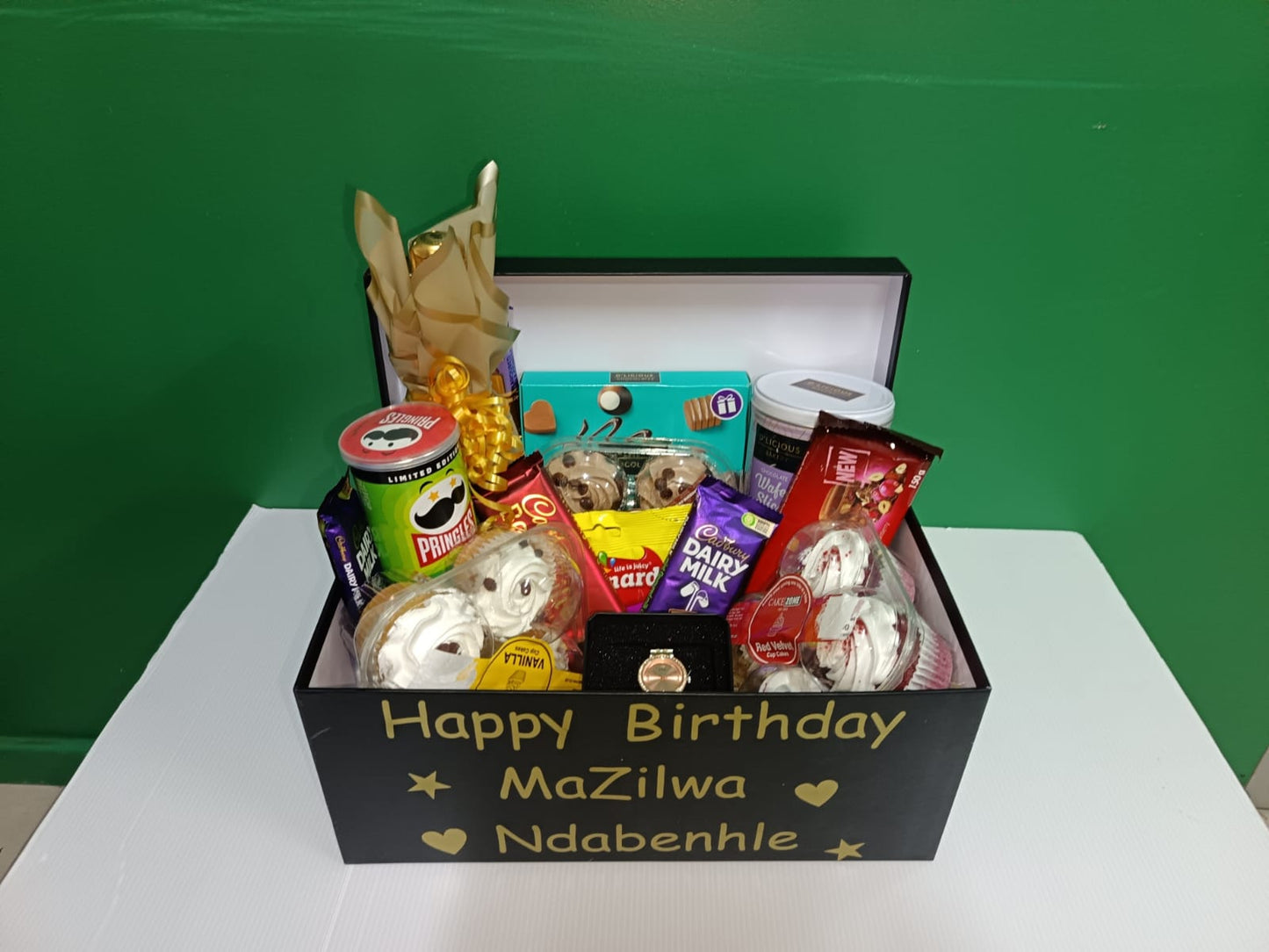 Gift box with snacks and a 'Happy Birthday' message