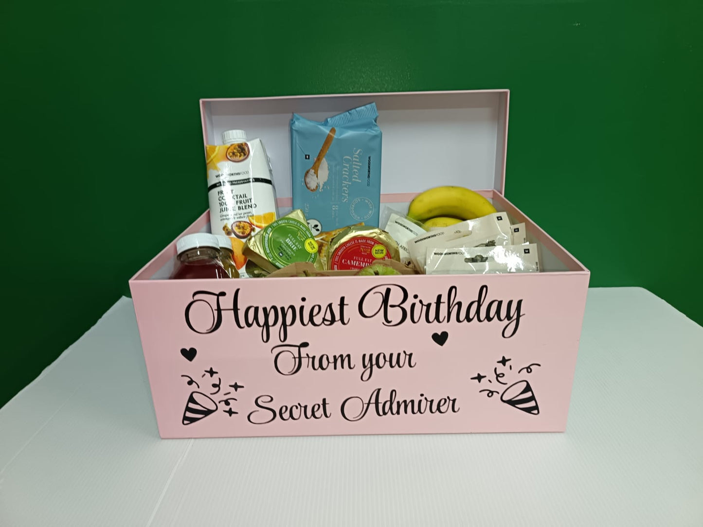 Pink gift box with snacks