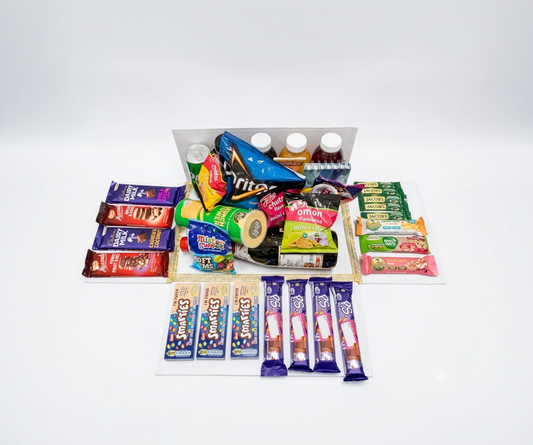 Assorted snack items including chips, drinks, and candy bars on a white background