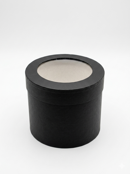 Black cylindrical container with a circular window on a white background