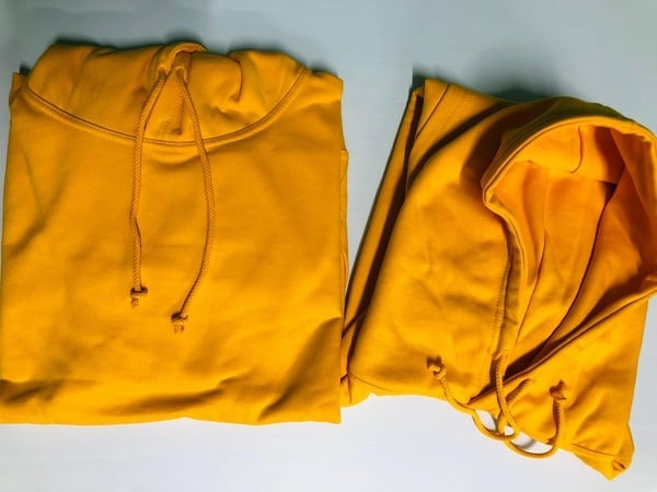 Yellow hoodie on a white background.  Gifting in Pretoria.