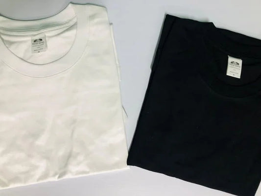 plain White and black t-shirts on a light gray background