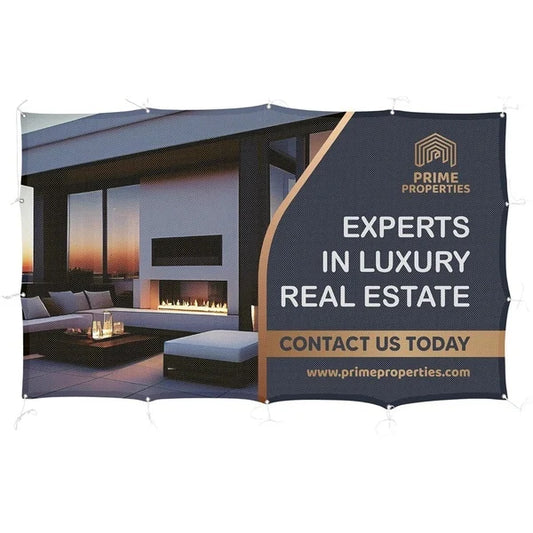 Prime Properties Outdoor Display Fabric Fence banner advertising luxury real estate with a modern outdoor living space in the background.