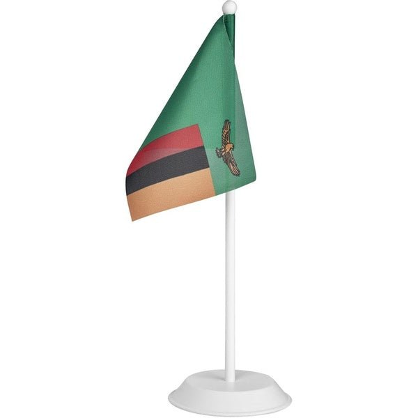 Small table flag with a green background, red, black, and brown stripes, and an eagle emblem on a white background.