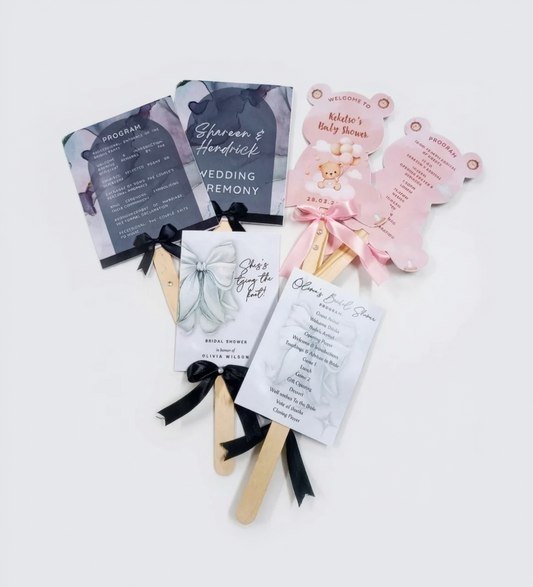 Set of wedding programs on sticks with decorative elements on a white background