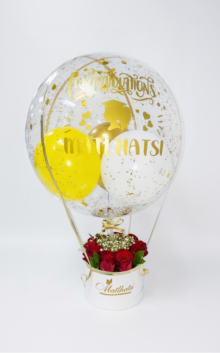 Decorative  balloon with 'Congratulations' featuring red roses inside.