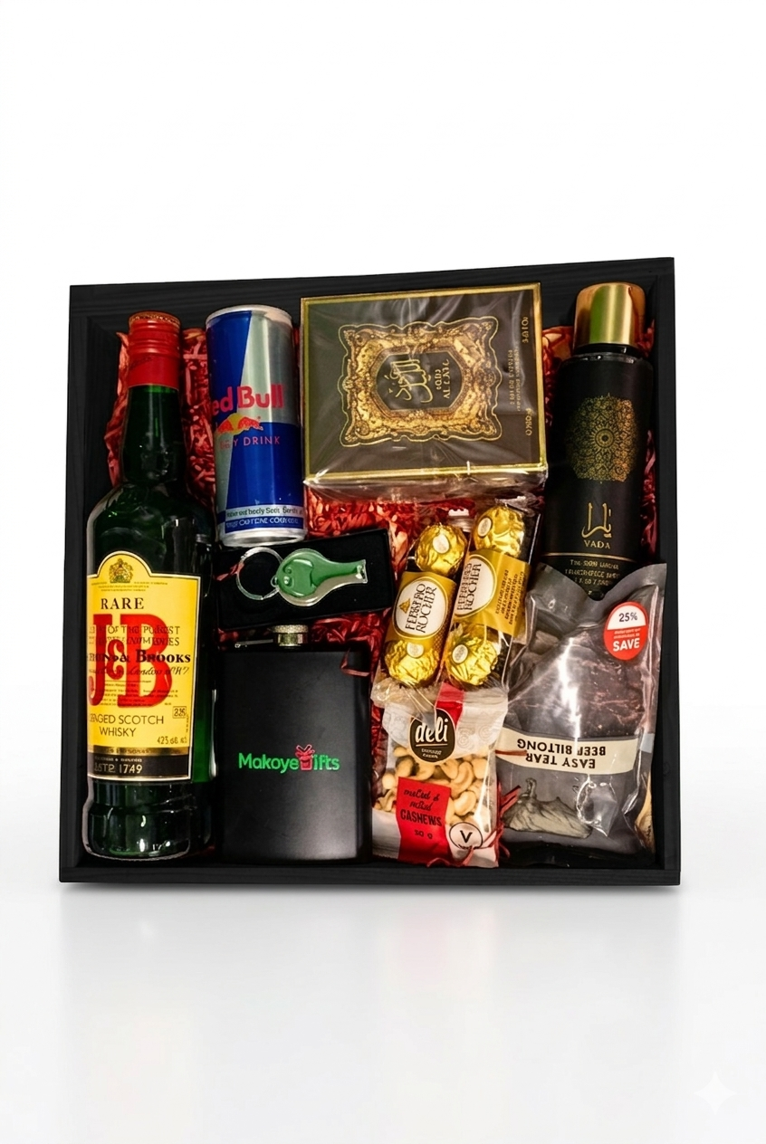 Gift set with a bottle of J&B Whisky, Red Bull energy drink, and various snacks in a black box.