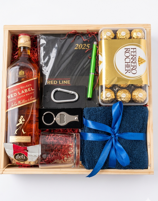 Gift set with Johnnie Walker Red Label whisky, socks, and Ferrero Rocher chocolates in a wooden box.