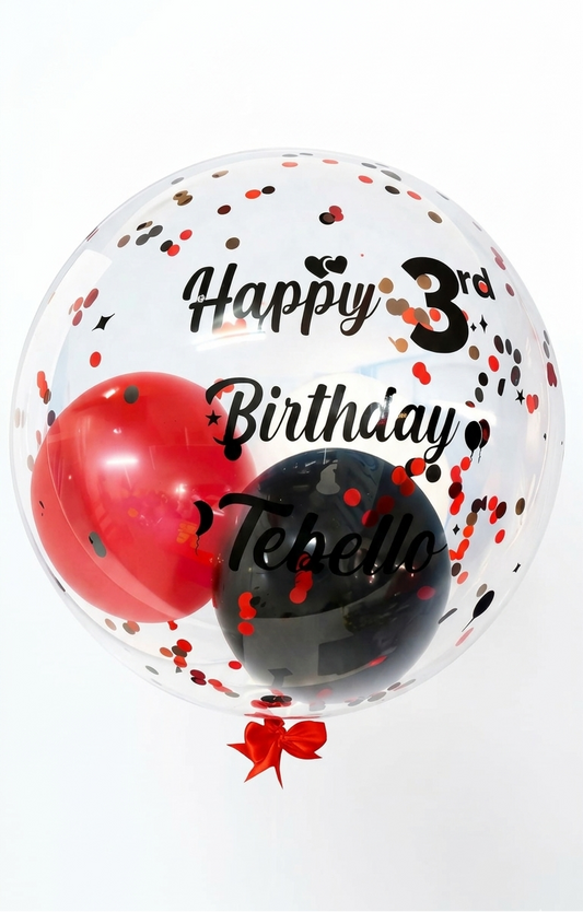 Transparent balloon with red heart, black circle, and confetti, featuring 'Happy 3rd Birthday Tebello' text.