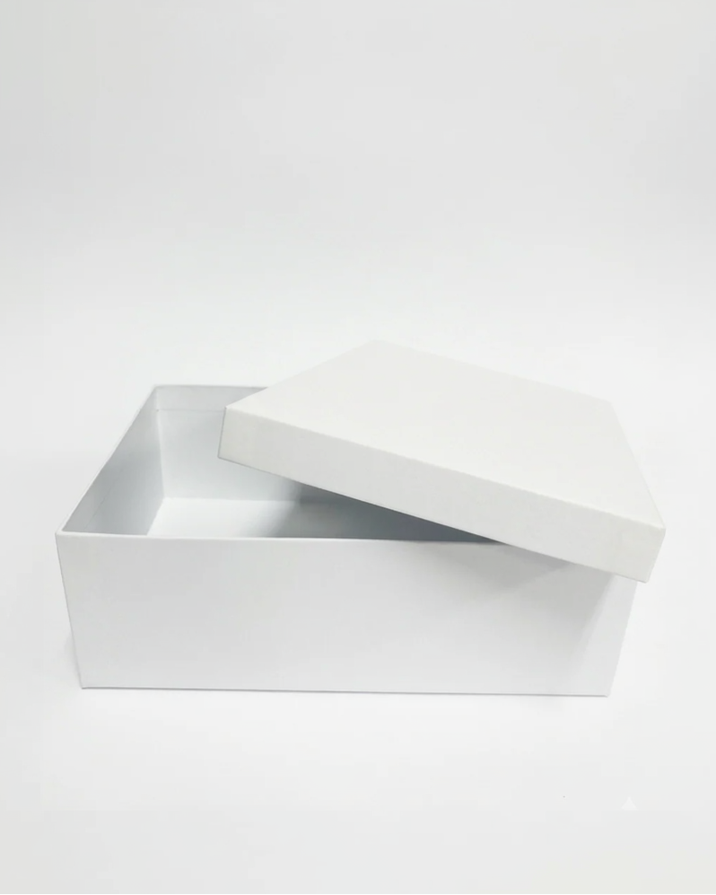 White rectangular box with a lid on a white background