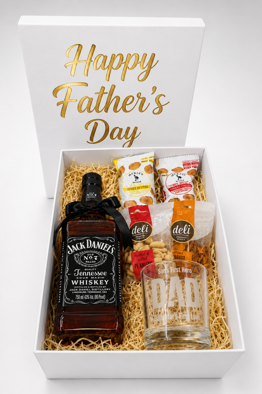 Gift box with Jack Daniel's whiskey, snacks, and a 'Dad' glass on a white background.