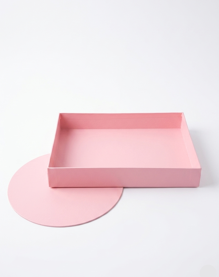 Pink rectangular tray and round mat on a white background