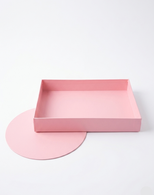 Pink rectangular tray and round mat on a white background