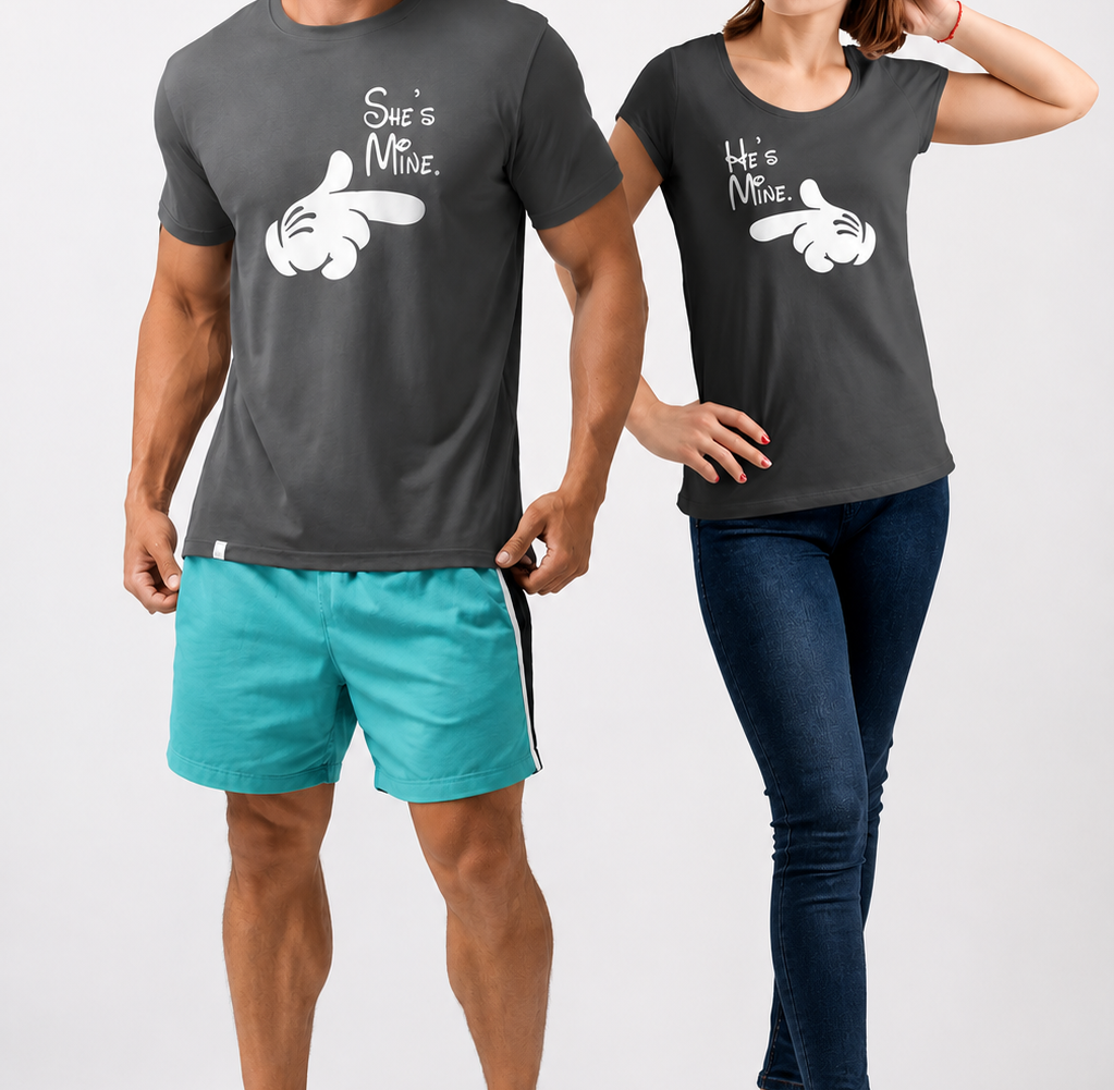 Two people wearing matching dark gray t-shirts with a graphic design on a white background