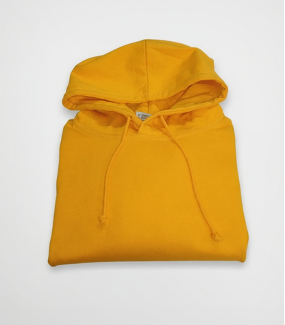 Folded yellow hoodie on a white background