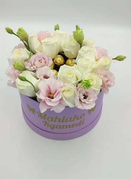 Floral arrangement in a purple box with 'Mahlako Kgamedi' branding on a light gray background