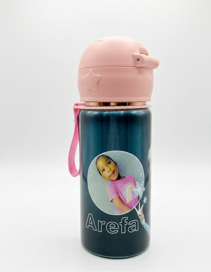 Children's water bottle with pink lid and handle, featuring a photo of a child and the name 'Arefa' on a white background.
