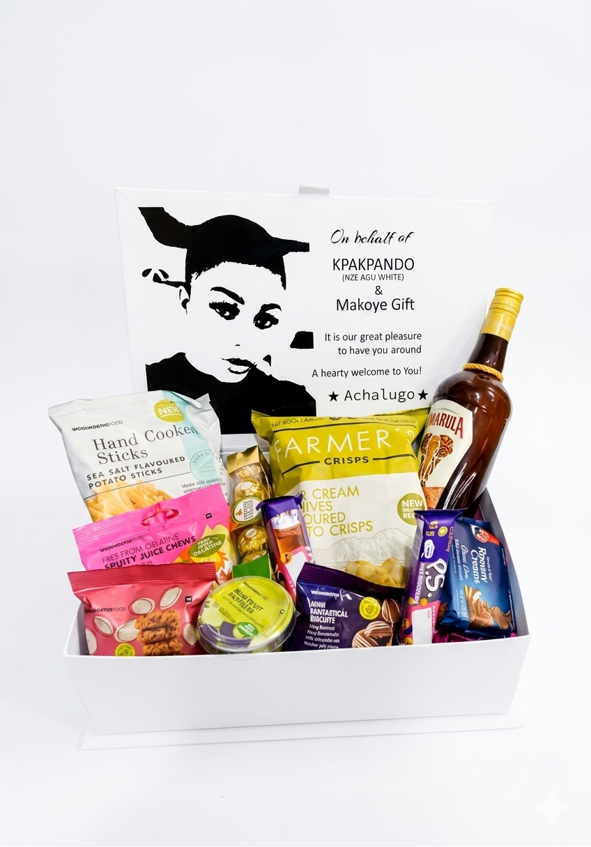 Gift basket with snacks and a bottle of alcohol on a white background