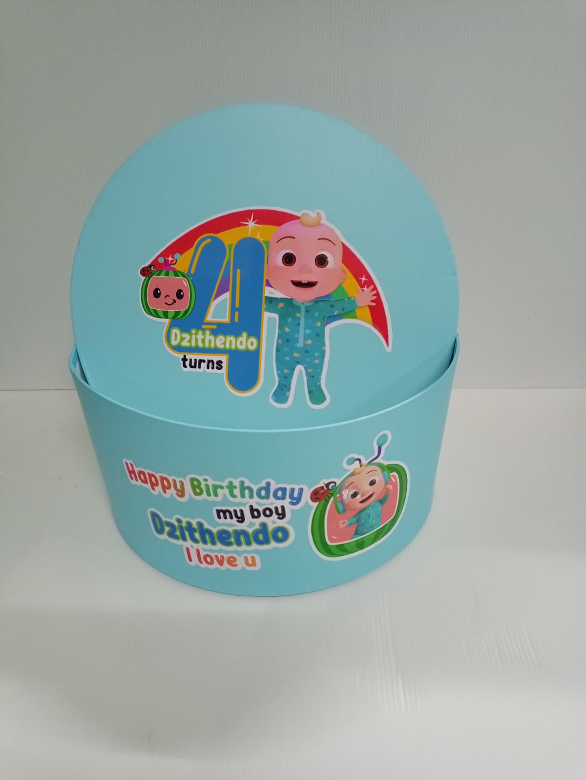 Blue birthday box with cartoon character and text on a white background.  Gifting in Pretoria.