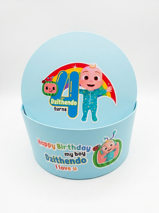 Blue birthday gift box with cartoon character and text on a white background