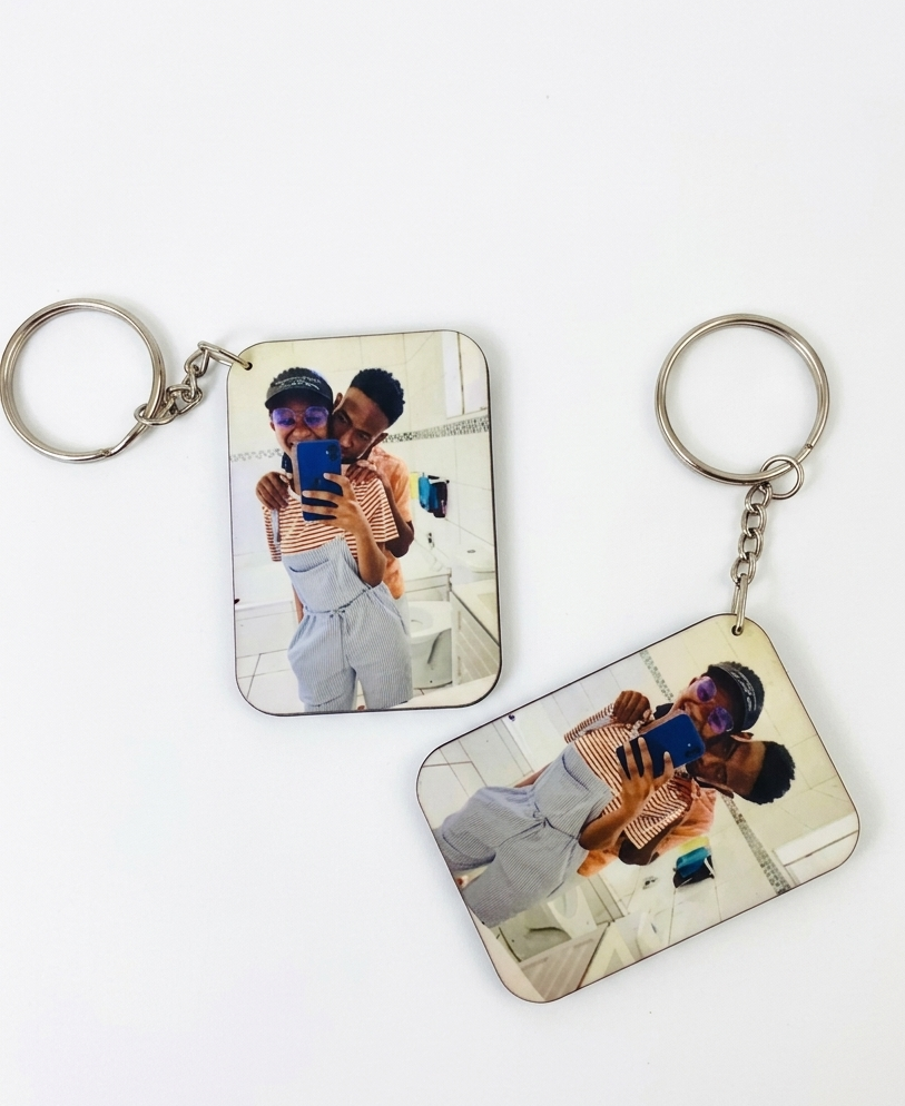 Two keychains with printed images on a white background