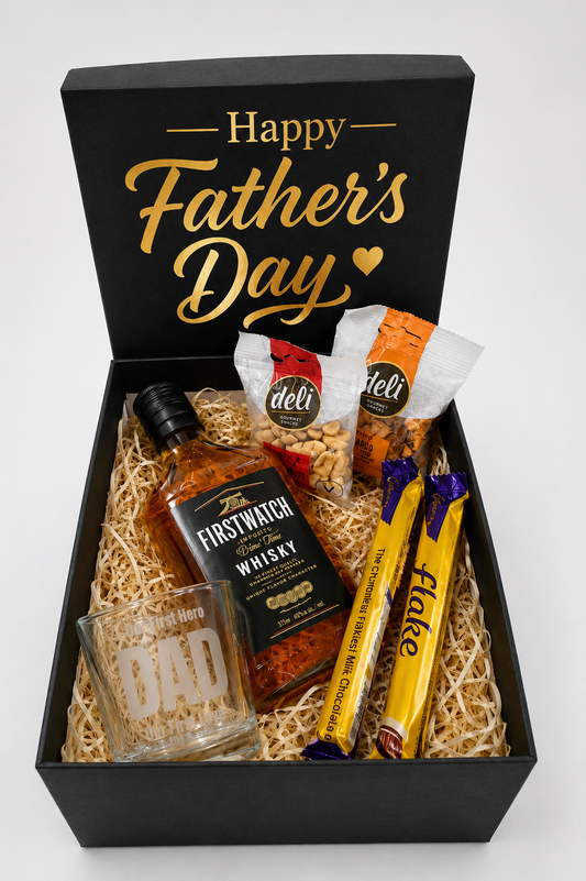 Father's Day gift box with whisky, glass, and snacks on a white background