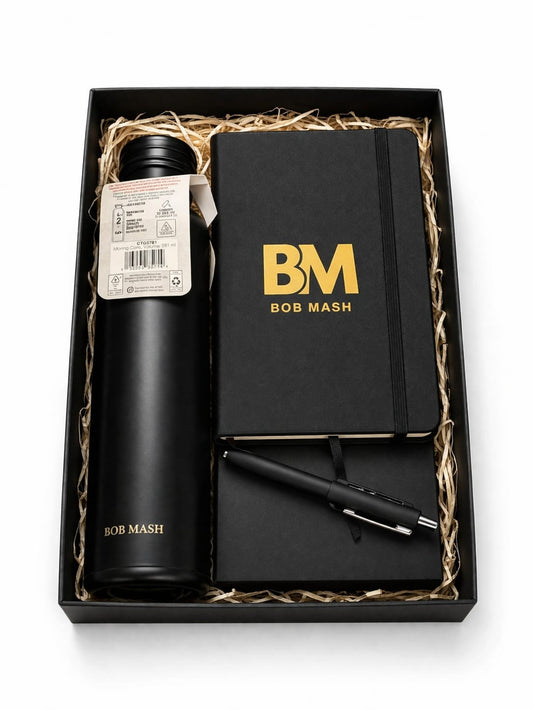 Black gift set with 'BM' branding including a thermos, notebook, and pen.