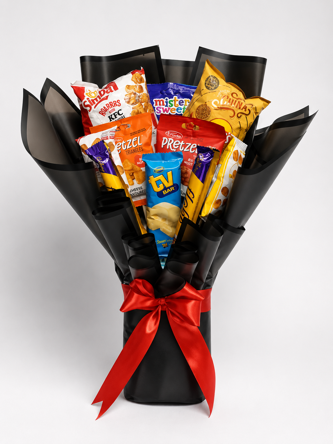 Bouquet of snack packets with a red ribbon on a white background
