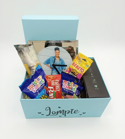 Gift box with snacks and a photo of a woman on a white background