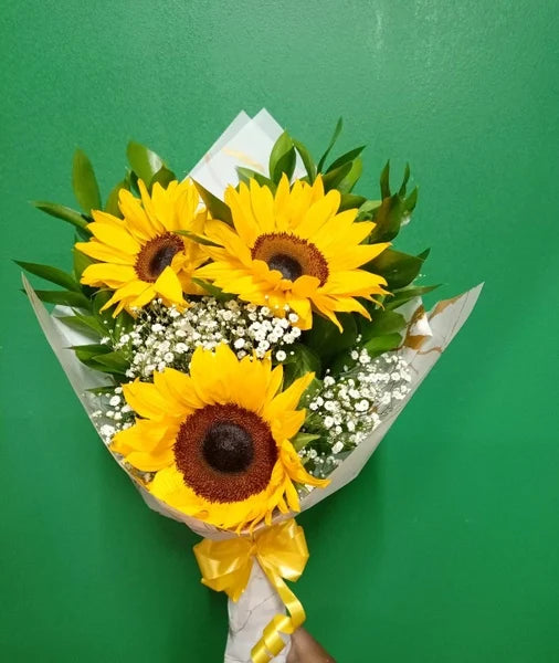 Bouquet of sunflowers with a green background