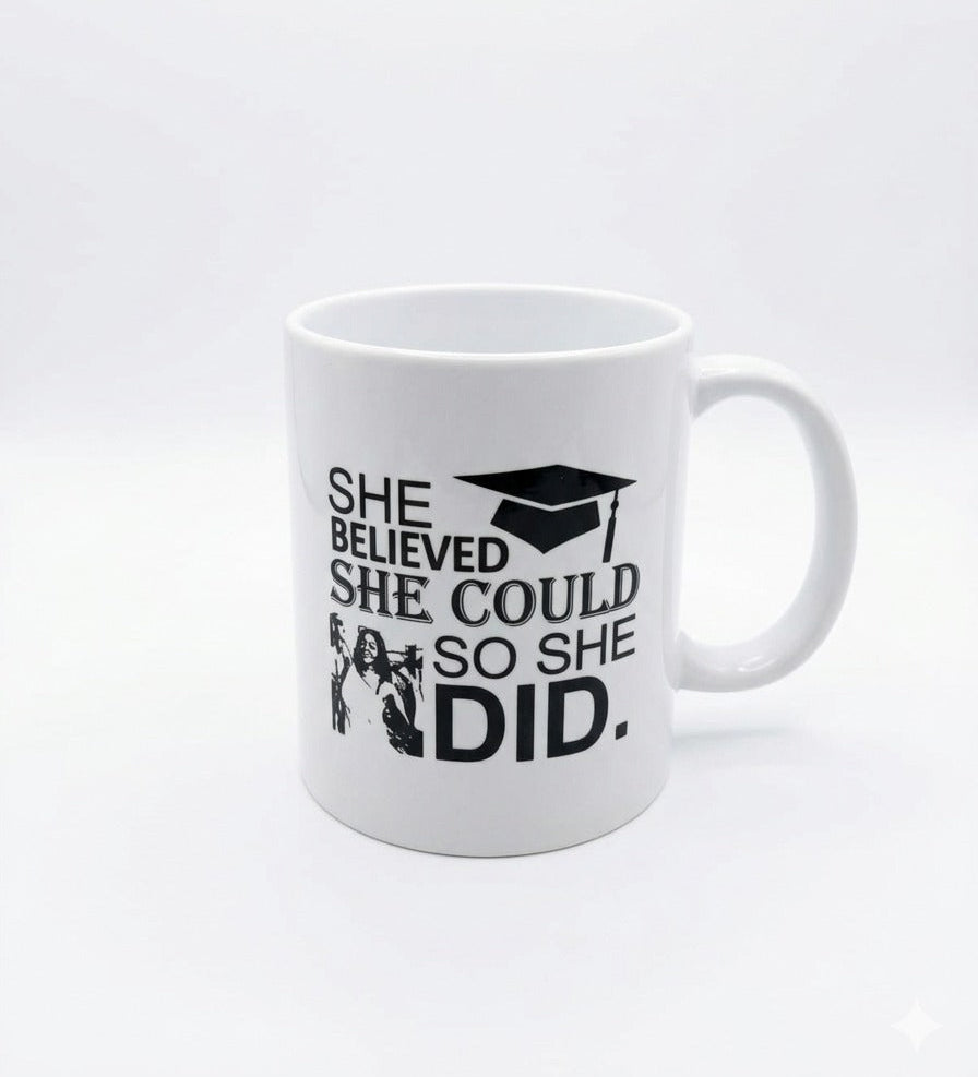 White mug with motivational quote and graduation cap design on a white background