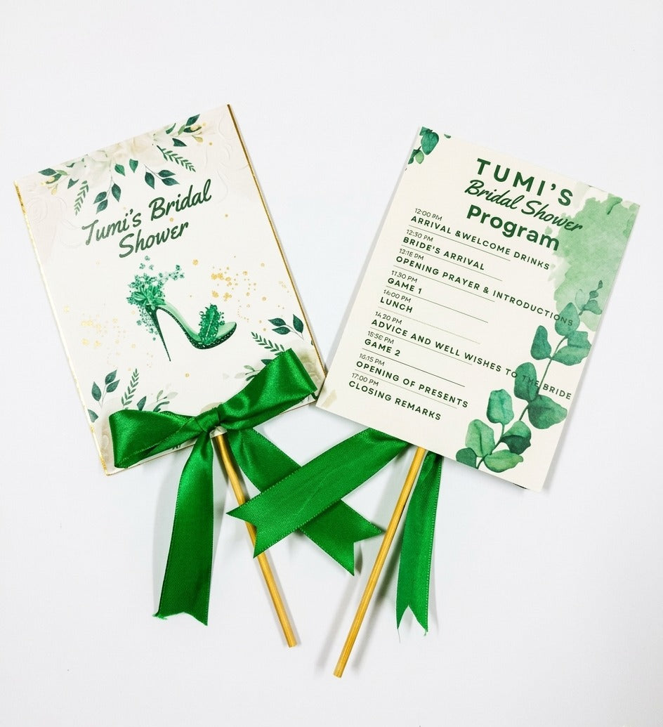 Bridal shower program cards with green ribbons on a white background
