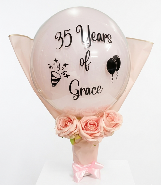 Decorative balloon with '35 Years of Grace' text and pink roses on a white background