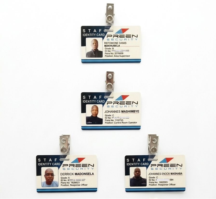 Set of five identity cards with clips on a white background